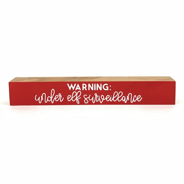 Under Elf Surveillance <br>Shelf Saying
